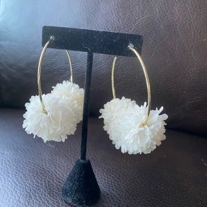 Large gold and white frilly hoops.